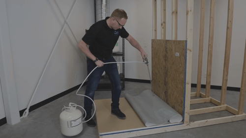 man using canister spray adhesive for product durability